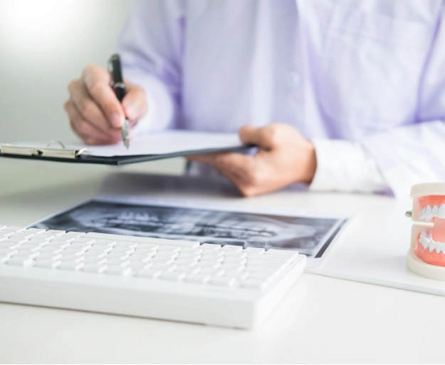 Dental Patient Completing Insurance Paperwork