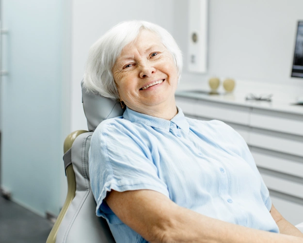 Senior Dental Patient Smiling After Root Canal Treatment