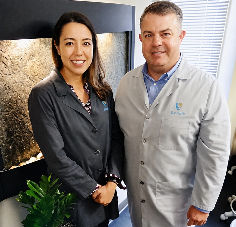 Happy dental patients smiling at the practice